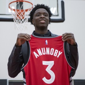 Toronto Raptors 2017 first round draft pick OG Anunoby holds a jersey as he poses for a picture after scrumming with journalists during a media availability in Toronto on Friday, June 23, 2017. THE CANADIAN PRESS/Chris Young
